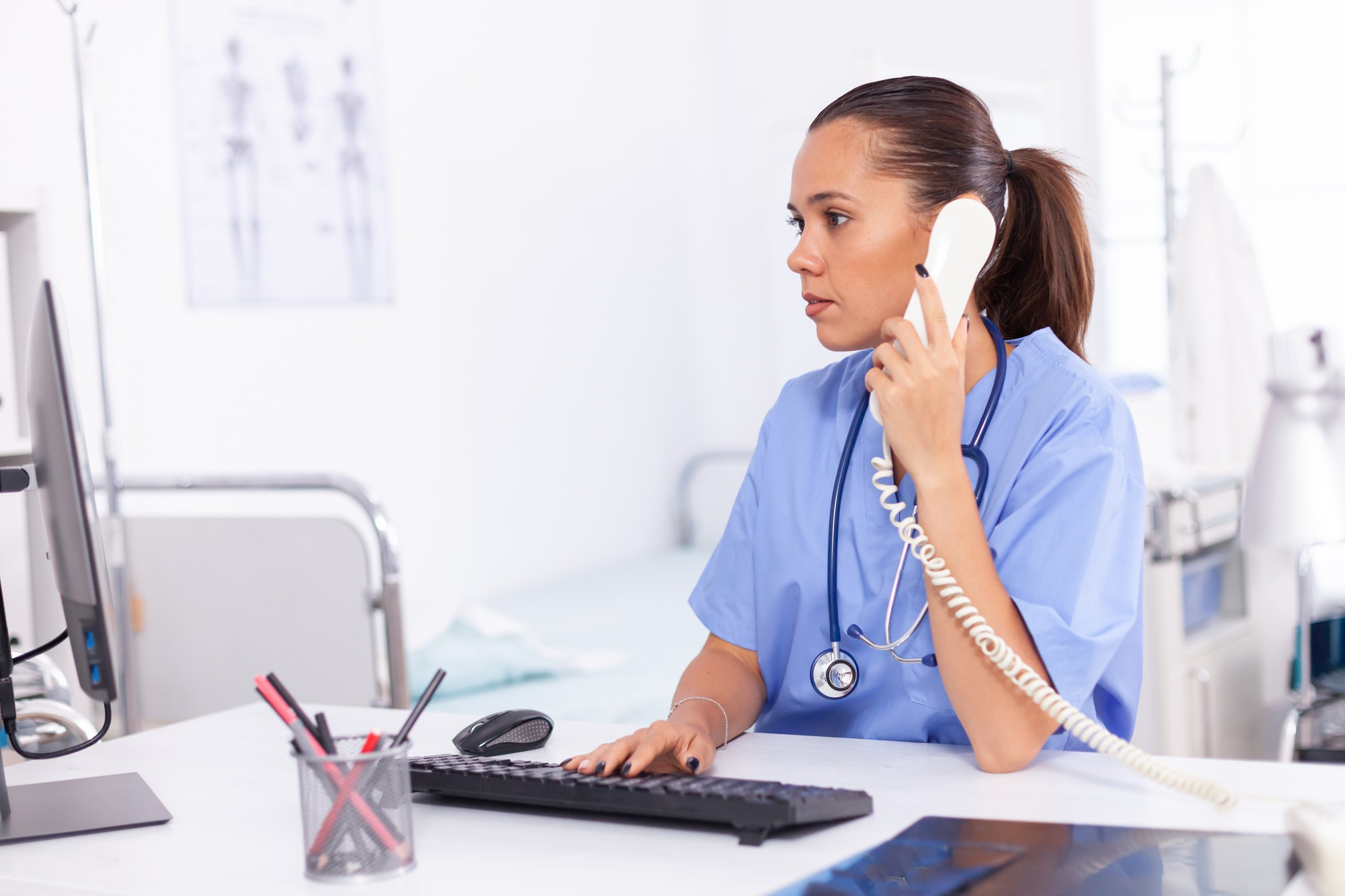 nurse answering a telephone call